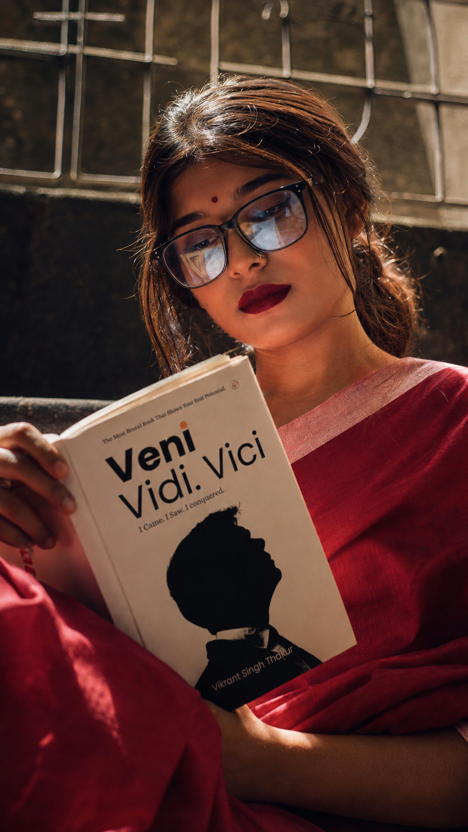 Reader holding Veni Vidi Vici